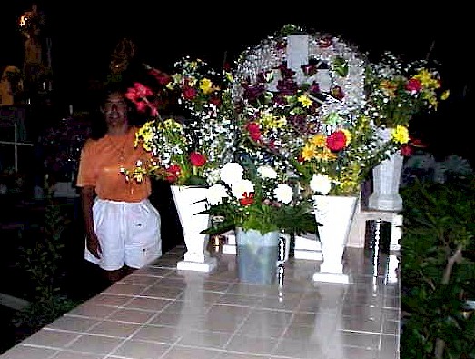Standing proudly by her mother's grave