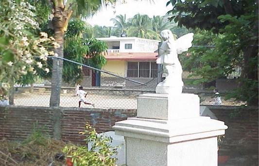 Cemetery borders a schoolyard