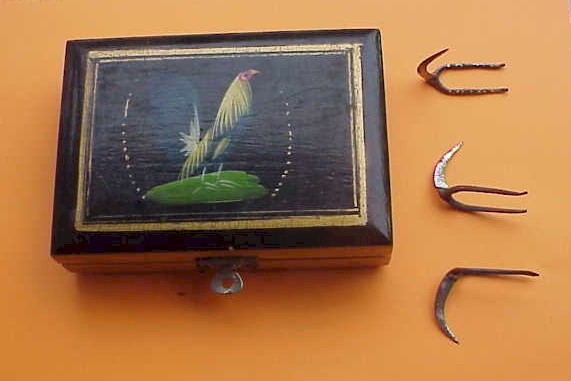 Velvet lined, hand-painted boxes carry deadly weapons