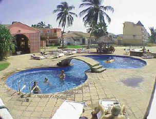 La Posada's pool and your room is just steps from the beach