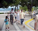 Families enjoy eating ice cream and walking together