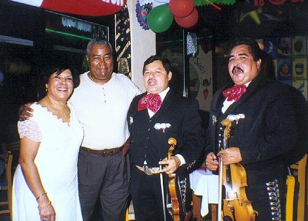 Americans Larry and Maria Reynolds sing along with the Mariachis