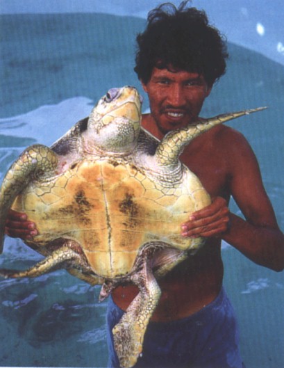 Assistant at sanctuary posing with a resident